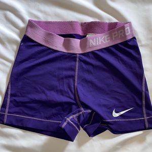 small nike pro spandex shorts; purple w/ pink band